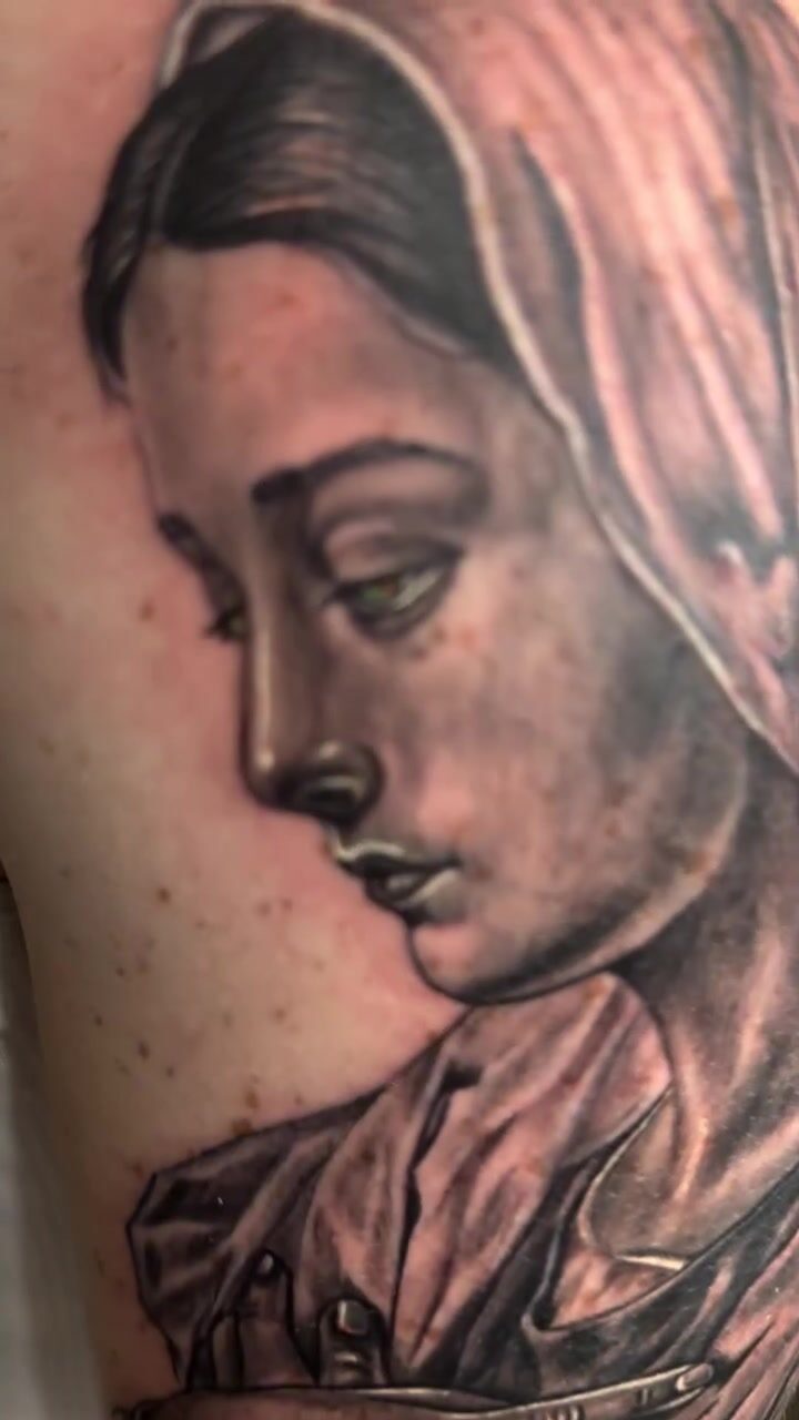 Black and gray Madonna portrait tattoo